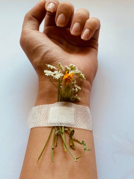 istock hand with flowers close up 1257533528