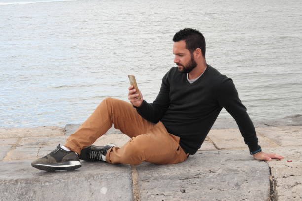 istock Distracted man by the river, Lisbon, Portugal 1257533848