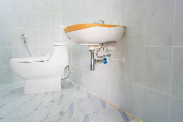 interior design Installation of sanitary ware and valves in bathroom flushing valve public restroom toilet stock pictures, royalty-free photos & images