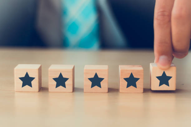 istock excellent rating voting by customer experience with hand putting highest rate five star. best services concept. 1257534699