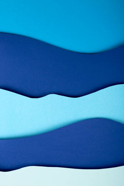 istock Blue background paper art sea waves with copy space. 1257538686