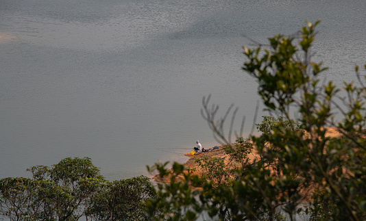April 10, 2020, Hong Kong: A man is seen fishing at Wong Nai Tun Reservoir in Tuen Mun, Hong Kong.