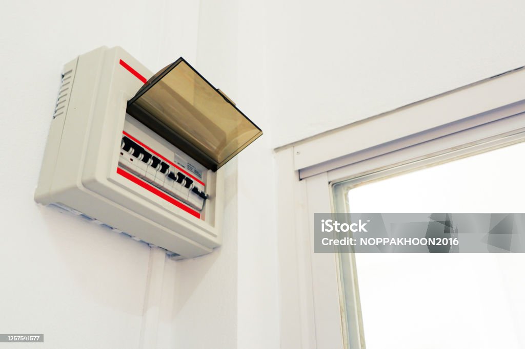 technology and motor pump The position of electrical consumer box is install on cement wall in house Electric Switchboard Stock Photo