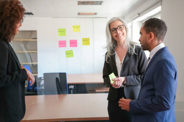 istock Content young businesspeople discussing marketing plan 1257541654