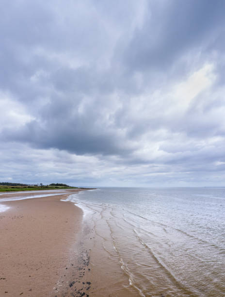 istock Vertical panoramic view of a deserted Scottish beach on a summer morning 1257543381