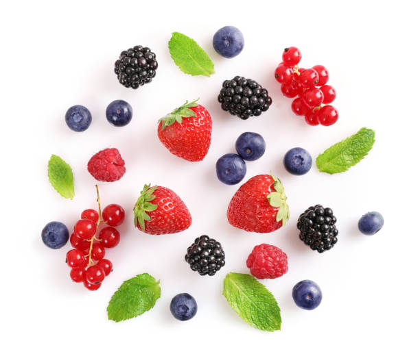 istock Assorted wild fresh berries isolated on white background. Top view 1257543443