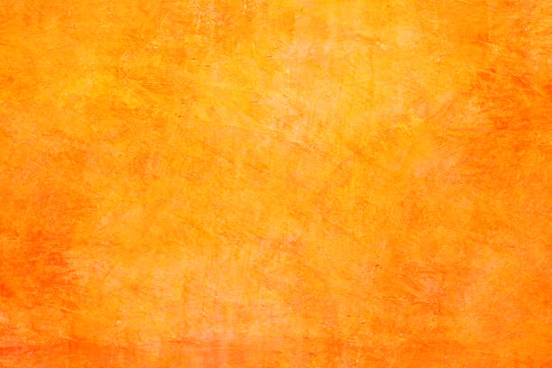 istock Texture of orange concrete wall background. 1257545594