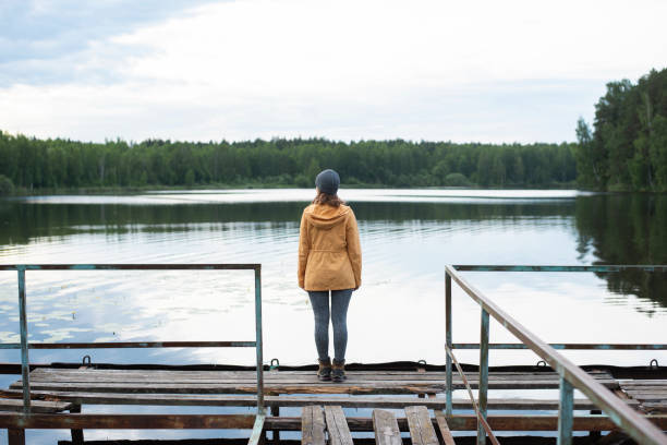 istock Female traveller looking at lake view 1257546118