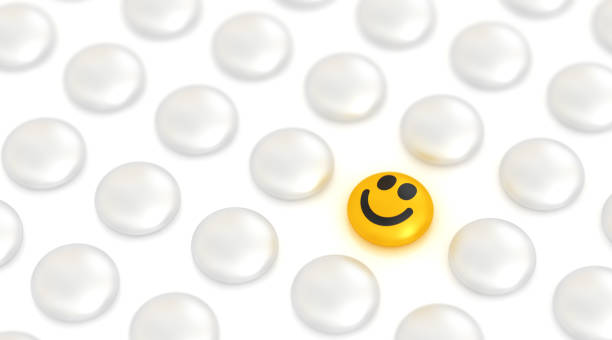istock Unique positive smiley face. Standing out from the crowd. 1257546549