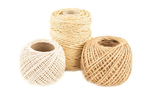 Linen, hemp and cotton rope reels isolated on white background.