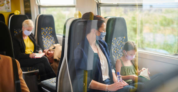 istock train passengers wearing homemade masks 1257550261