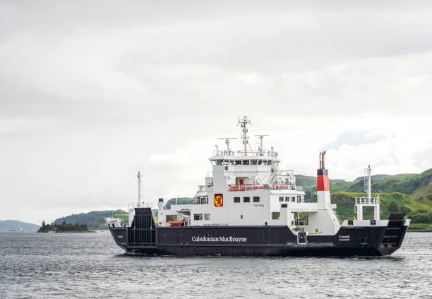 Caledonian MacBrayne ferry Oban, Scotland - A small Caledonian MacBrayne ferry service coming into Oban harbour on Scotland's West Coast. oban stock pictures, royalty-free photos & images