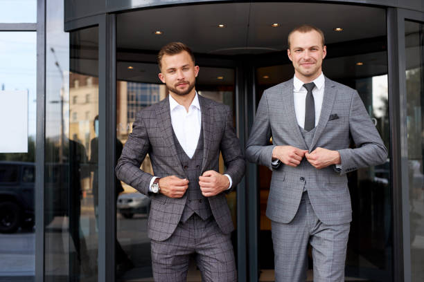 istock two business men button up the jacket 1257552864