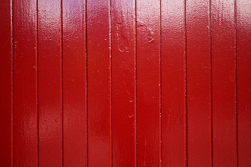Shiny red gate closeup.