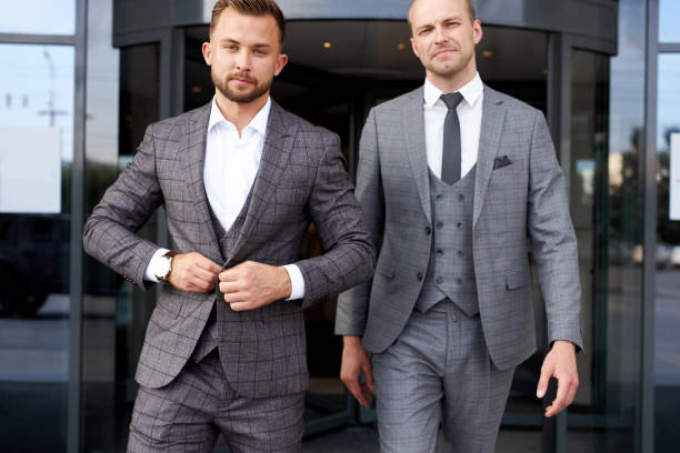 istock successful business partners leave building 1257553079