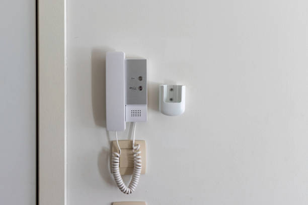 white intercom on the wall in the apartment