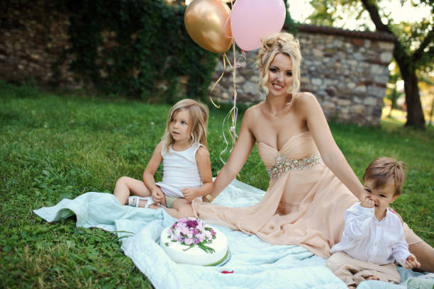 Happy mother spending time with her small kids