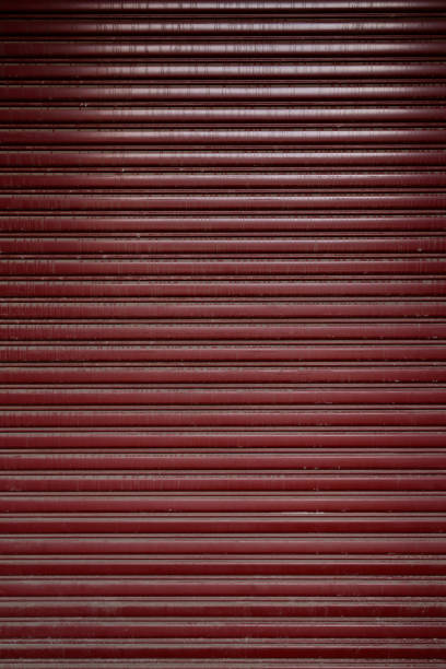 istock Reddish brown metal garage door 1257554029