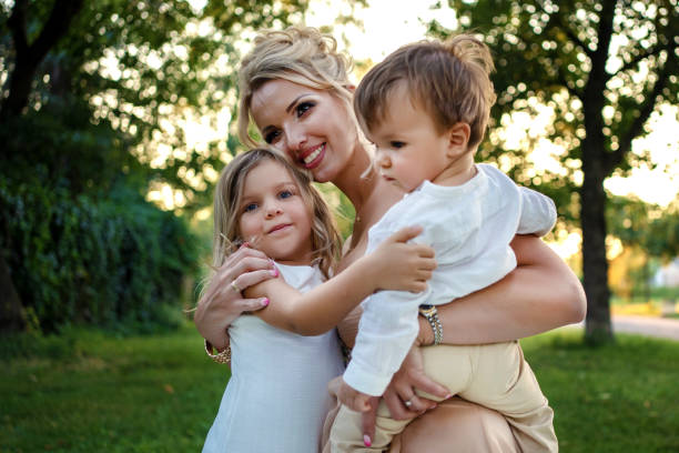 istock Happy smiling mother and children 1257554152