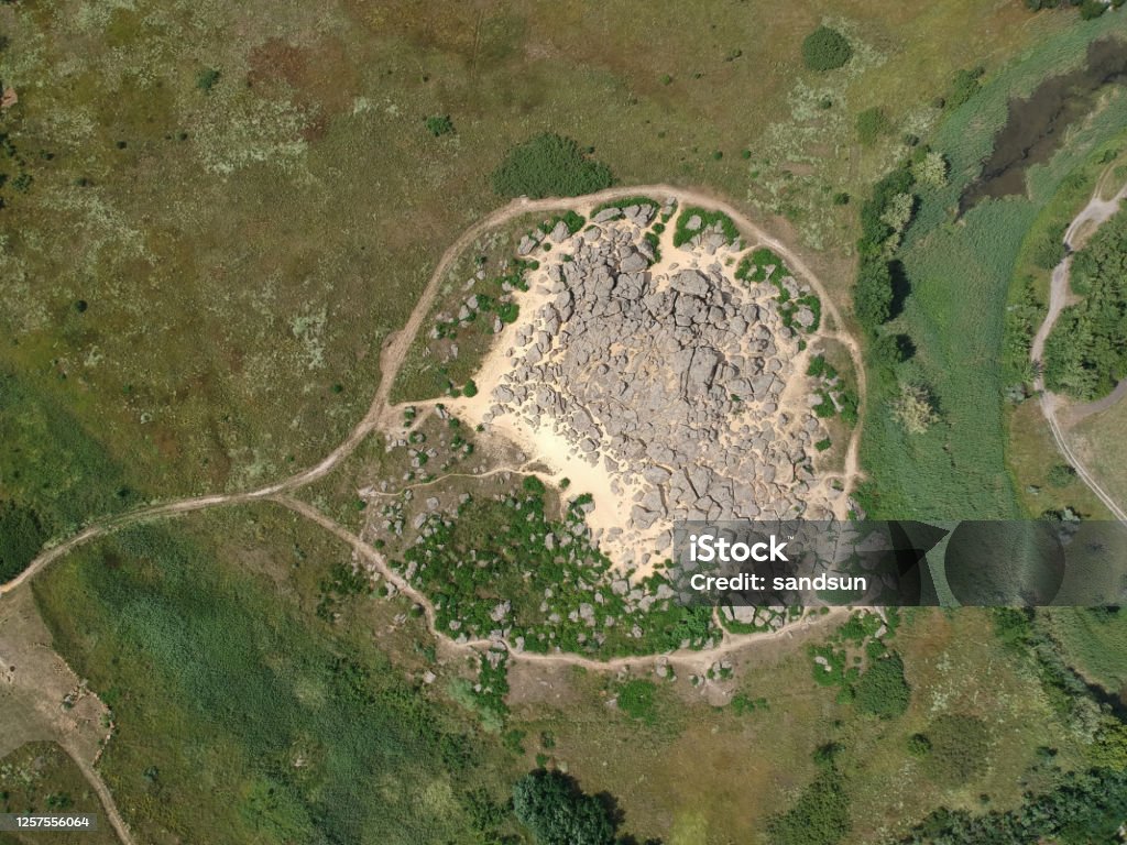 Aerial top view of big stones named Kamyana Mohyla, Melitopol Ukraine Aerial top view of big stones named Kamyana Mohyla, Melitopol Ukraine. Drone photo Aerial View Stock Photo