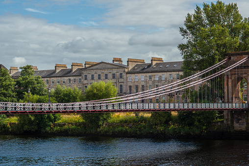 South Portland Street Suspension Bridge Over the River Clyde With Carlton Place in the Background in Glasgow Scotland