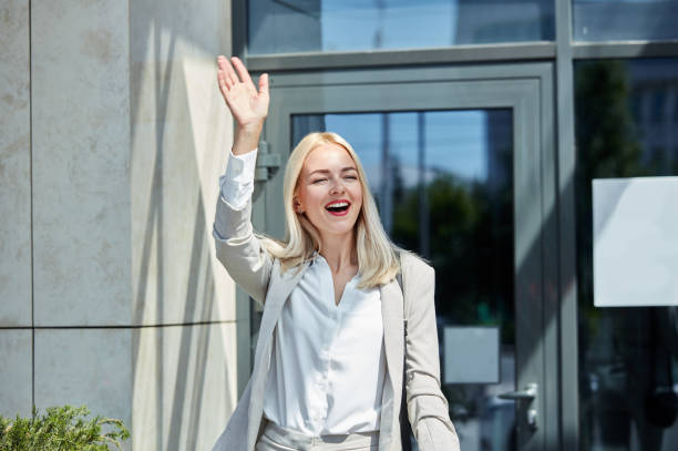 istock emotional happy woman say hello 1257556661