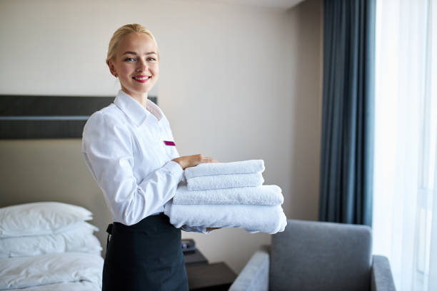 istock beautiful maid with towels in hands 1257556843