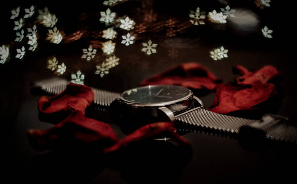 istock Clock with rose petals on bokeh background 1257556879
