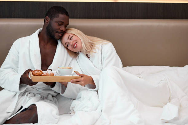istock cute couple have breakfast on bed 1257556934