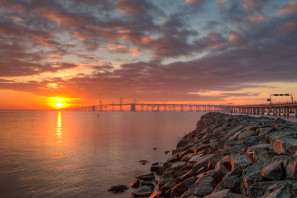 Sunset from the Jetty Sunset from the jetty in Sandy Point State Park in Anne Arundel County, Maryland. bay bridge stock pictures, royalty-free photos & images