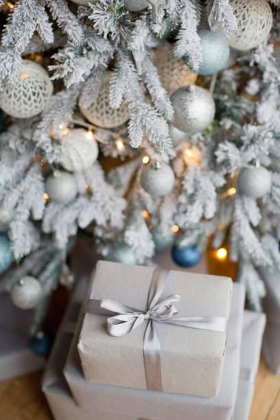 istock Craft Christmas boxes near Christmas tree 1257557298