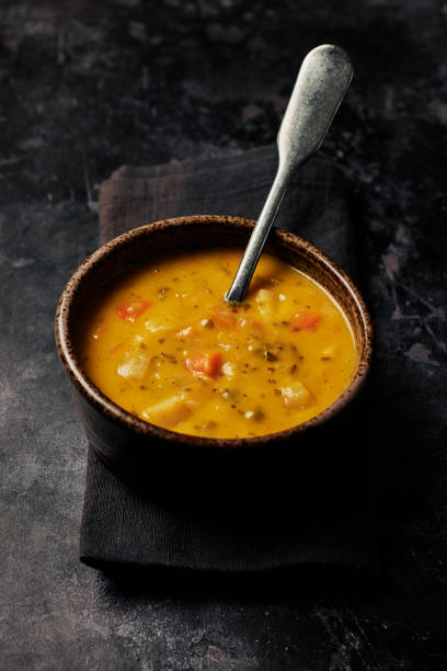 istock Bowl of Vegetable Soup against a dark marbled background. 1257557702