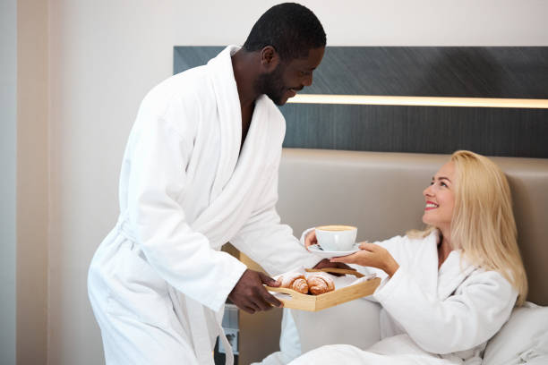 istock generous kind man brought breakfast to bed to his beloved girlfriend 1257559103