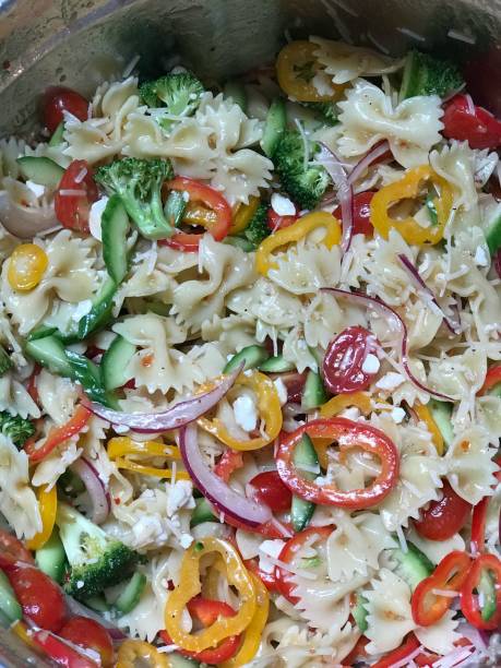 istock Pasta salad with red onion and peppers 1257560655