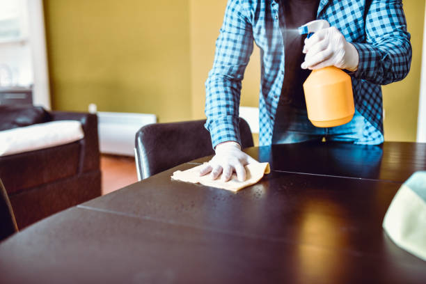 istock Male In Checked Shirt Cleaning Kitchen Table 1257561890