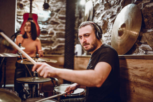 istock Drummer Recording A Song In Studio With Band 1257562422