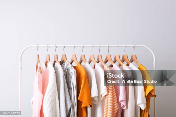 Fashion Clothes On A Rack In A Light Background Indoors Place For Text Stock Photo - Download Image Now