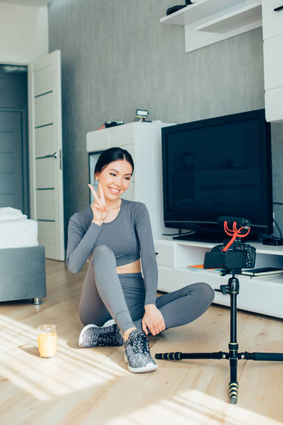 istock Pretty lady showing peace gesture to the camera 1257563463