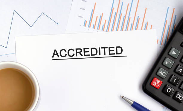 istock Accredited document with graphs, diagrams and calculator and a cup of fragrant coffee 1257563736