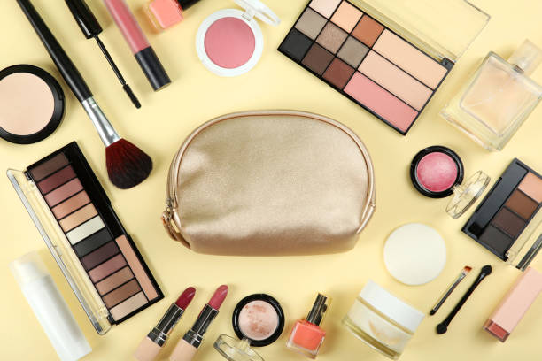 istock professional makeup tools. Makeup products on plain background top view. A set of various items for makeup. 1257563853