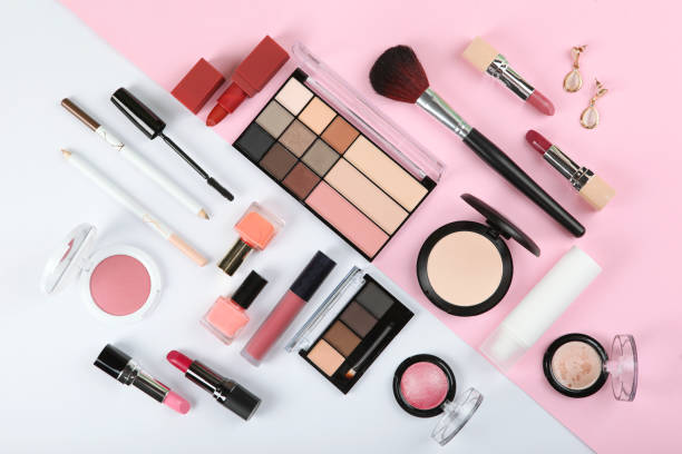 istock professional makeup tools. Makeup products on plain background top view. A set of various items for makeup. 1257563869
