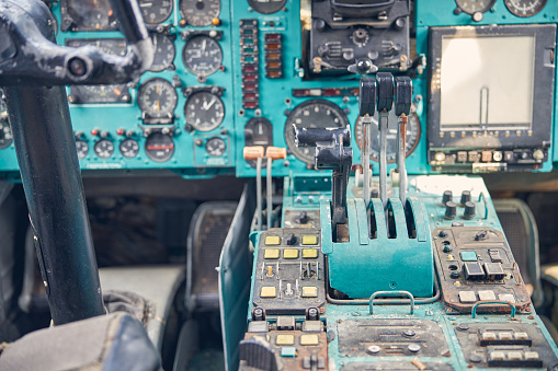 Close up of detail of instruments being adjusted in the plane cockpit