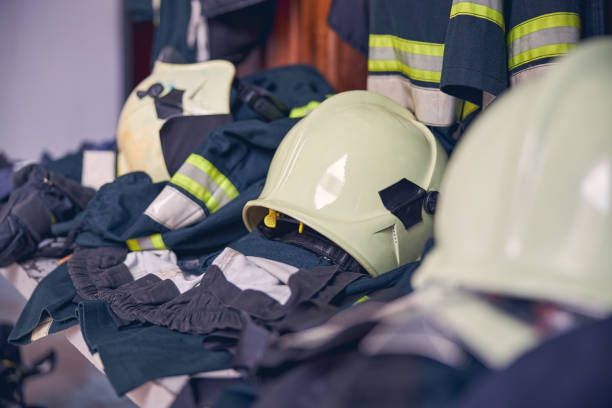 Close up portrait of protective work uniform lying in the bench