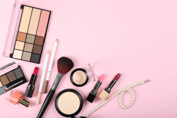 istock professional makeup tools. Makeup products on plain background top view. A set of various items for makeup. 1257564448