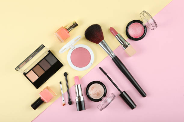 istock professional makeup tools. Makeup products on plain background top view. A set of various items for makeup. 1257564455