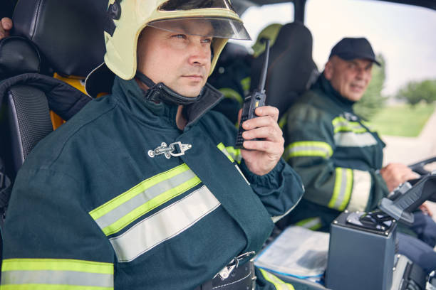 istock Strong firefighter with walkie talkie in hand 1257564999