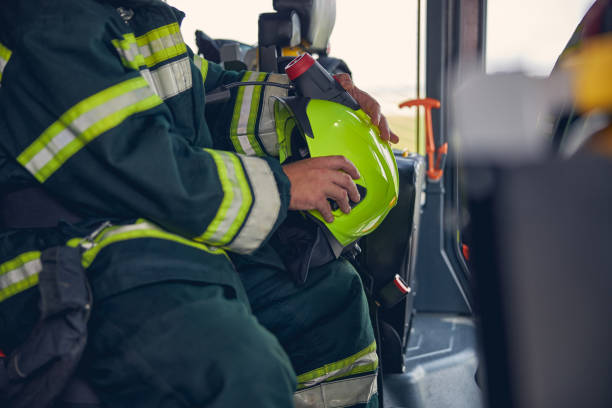 istock Portrait of firefighter wearing protective uniform in the fire machine 1257565003