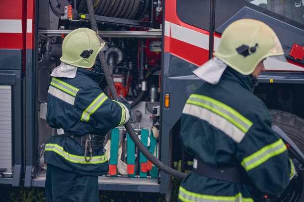 istock Fireman in protective uniform operating on the fire truck 1257565060
