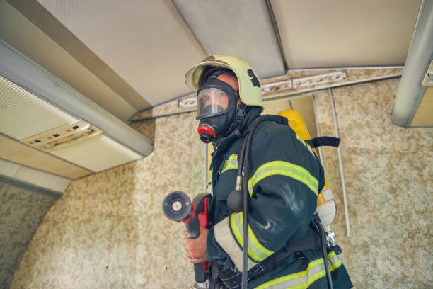 istock Portrait of firefighter dressed in uniform and an oxygen mask 1257565078