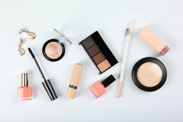 istock professional makeup tools. Makeup products on plain background top view. A set of various items for makeup. 1257565089
